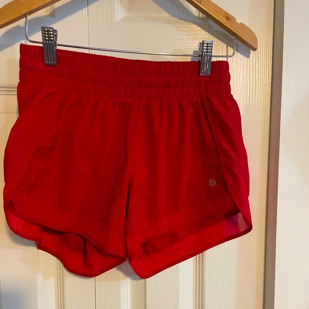 Red athletic shorts.